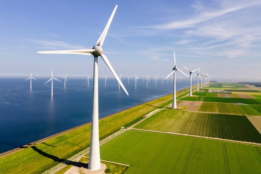 Windmills,Turbines,And,A,Blue,Sky,Generating,Electricity,Green,Energy